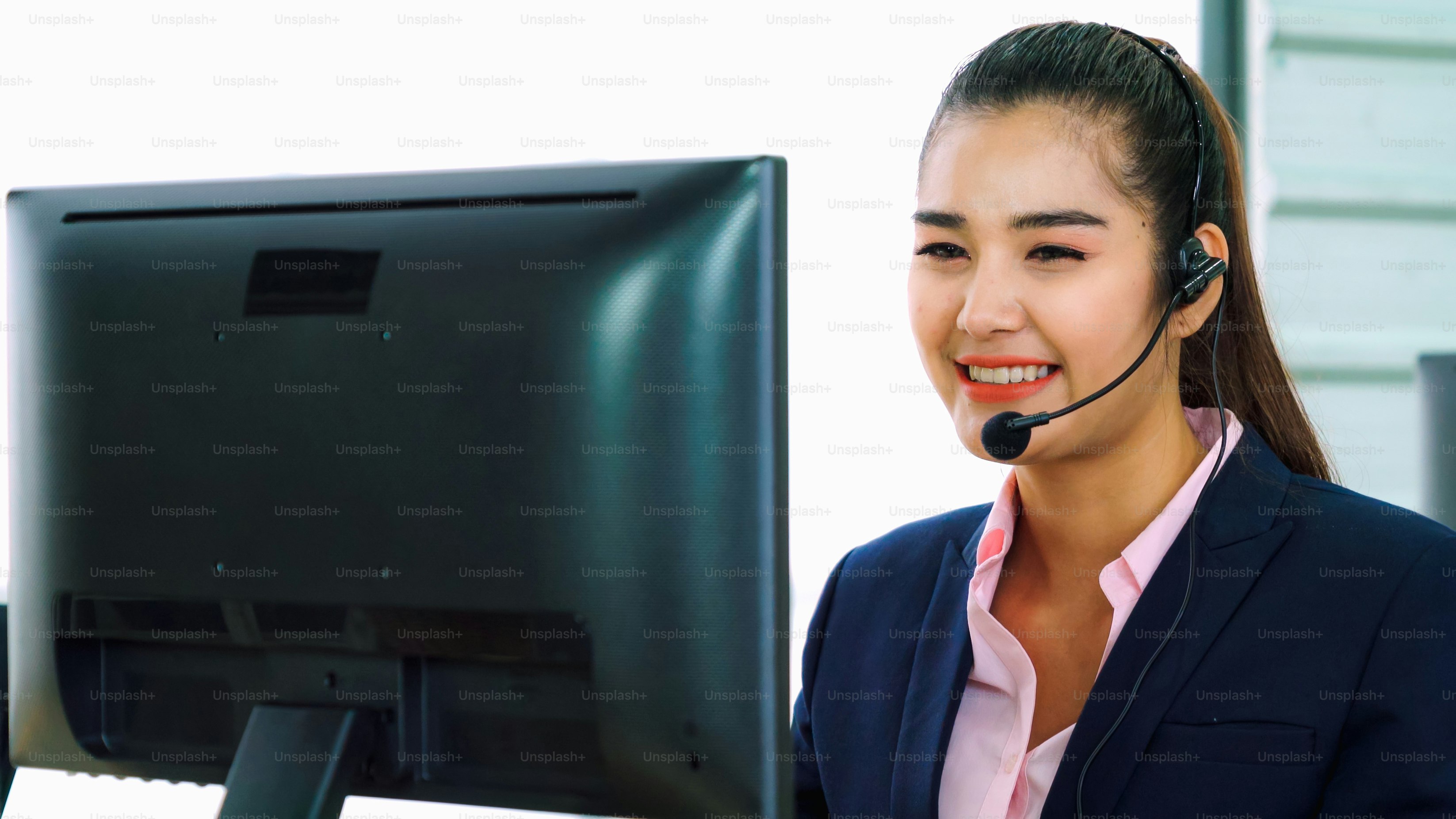 Business people wearing headset working in office to support remote customer or colleague. Call center, telemarketing, customer support agent provide service on telephone video conference call.